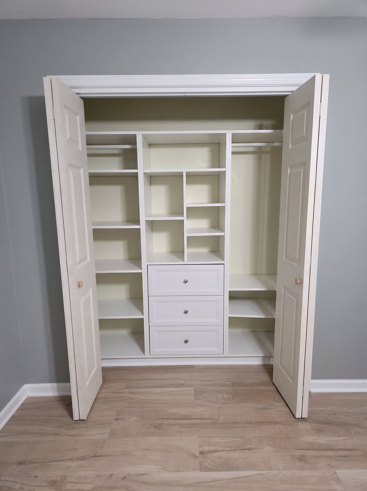 Double doors with new casing opening to a custom reach-in closet