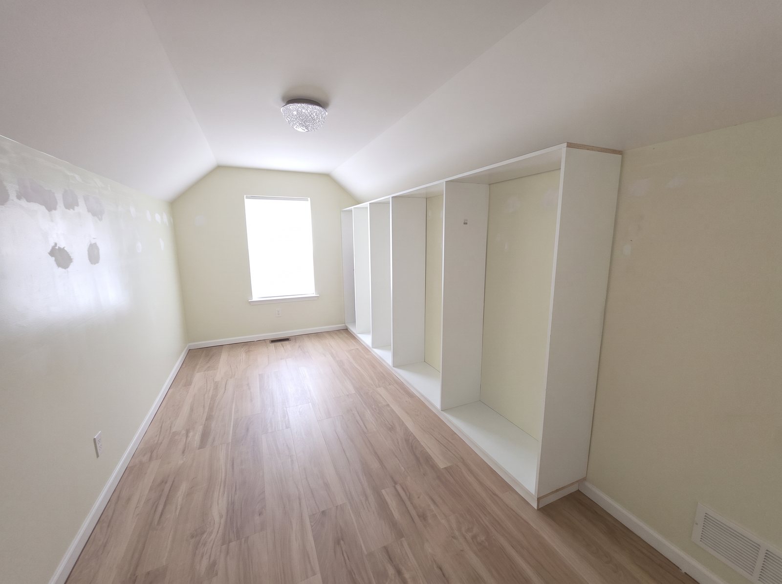 Before: empty attic room with bare walls