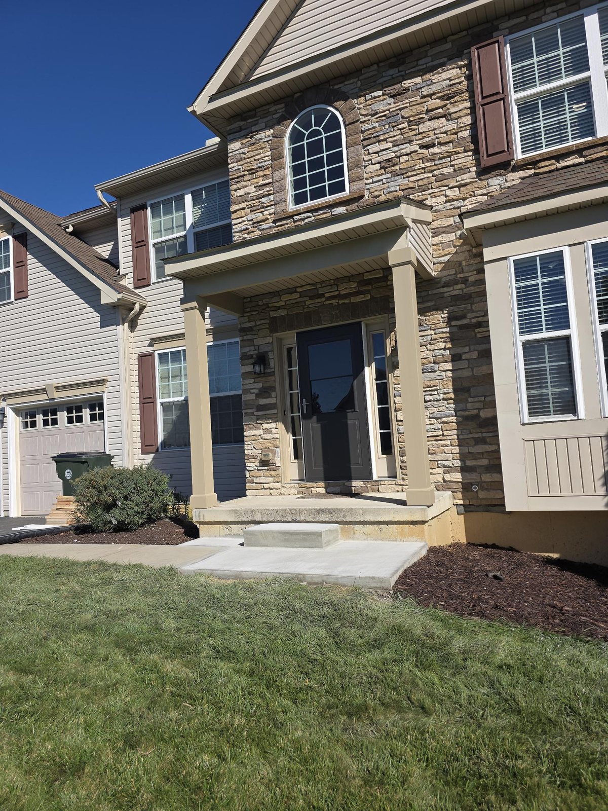 Stone front porch with new square columns
