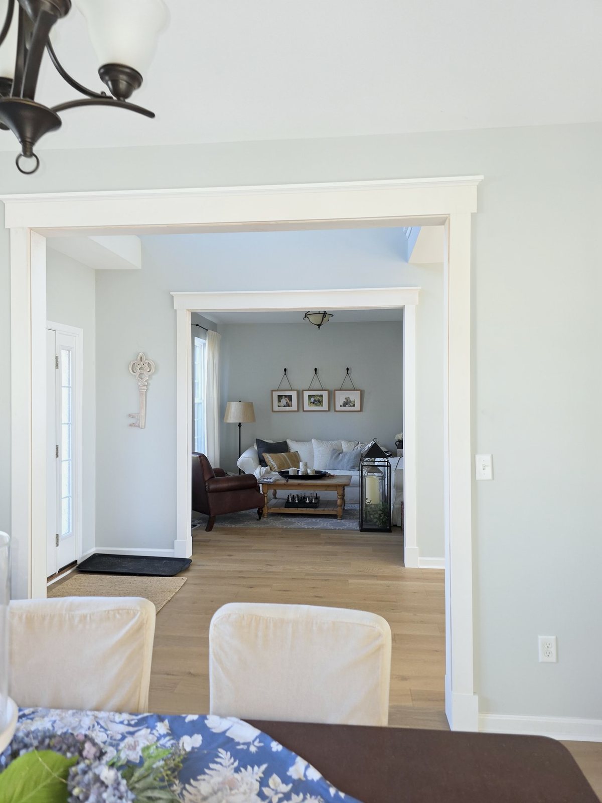 Two cased openings with craftsman-style headers and wide white casing